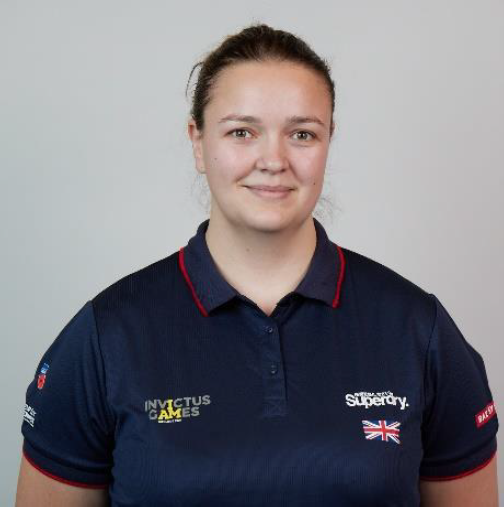 Personnel wears Invictus Games uniform in portrait.